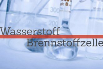 Reagenzgläser im Hintergrund, davor steht Wasserstoff Brennstoffzellen